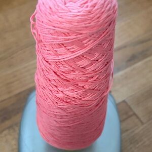 6.9 ounces of coral/pink yarn
